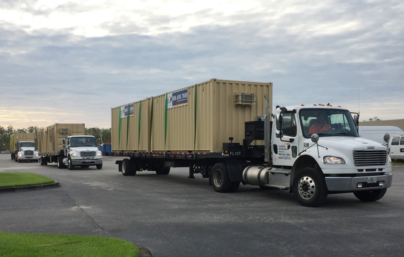 fleet of shipping container on trucks